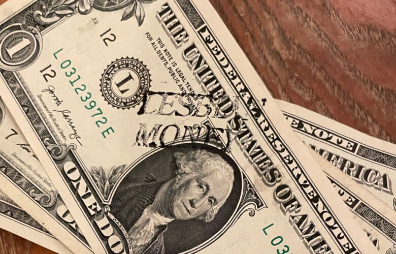 A one dollar bill with the words lesbian money stamped on it next to George Washington's portrait.